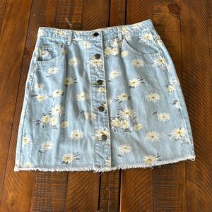 T S small Jean skirt with daisies. Frayed bottom. Very good condition.